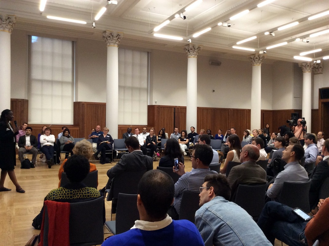 people listening to a person speaking