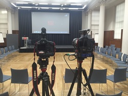 video cameras pointing to an empty stage