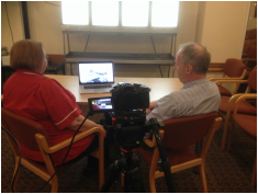 people watching a video on a computer