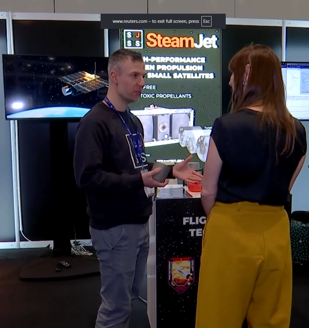 SteamJet’s CEO explaining their product at a 2026 Space Expo while Sound Motive’s animation plays in the background