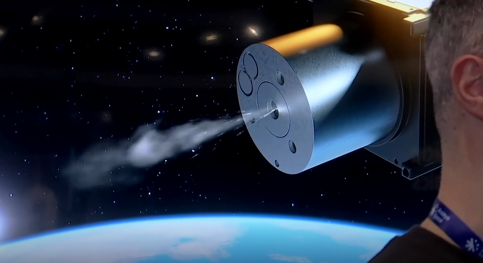 A close-up of Sound Motive’s animation playing at a Space Conference behind SteamJet Space System’s CEO